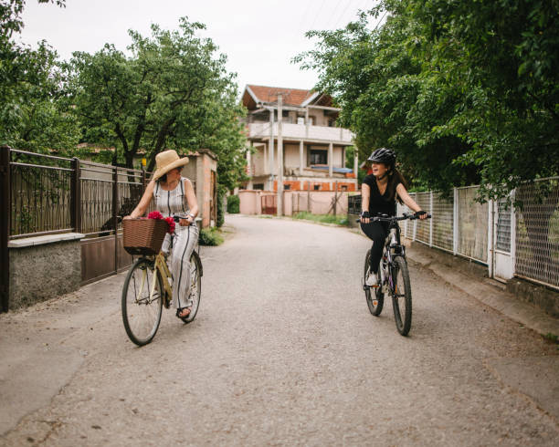 istock Mother and daughter riding bicycle. Stay unique, be yourself 1318623558