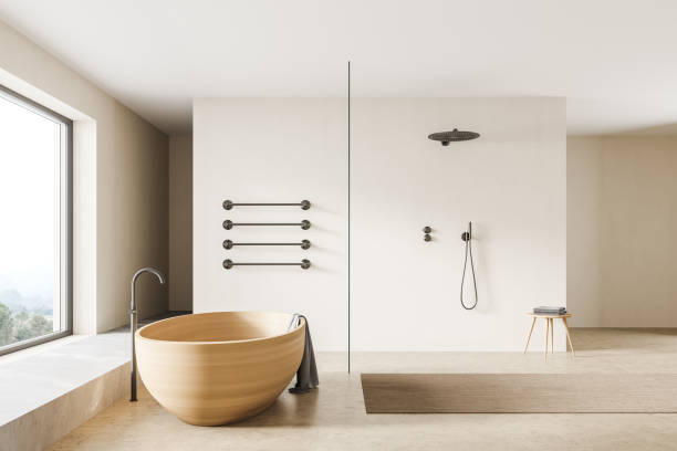 istock Beige bathroom interior with shower, bathtub on concrete floor 1318624185