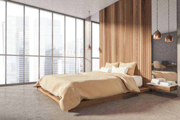 istock Grey and wooden bedroom interior with bed, window and workplace 1318624218