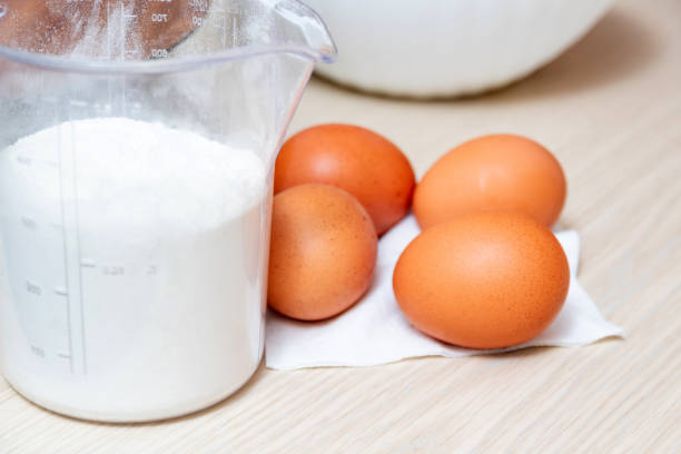 istock Ingredients for cooking autumn baking. Flour, eggs, sugar, pears and spices. White background. 1318627644