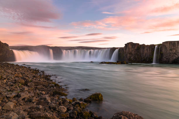istock Majestic waterfall in midnight light in summer 1318627807