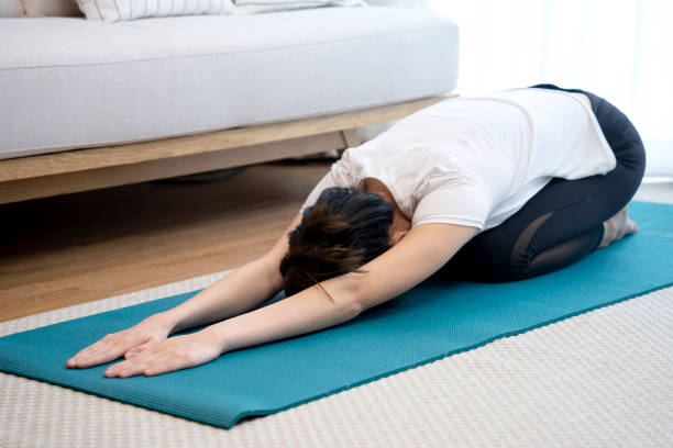 istock Young woman exercising in yoga pose 1318629541