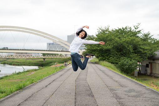 Woman jumping and dancing