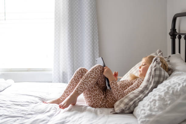istock Woman Relaxing On Bed At Home 1318632857