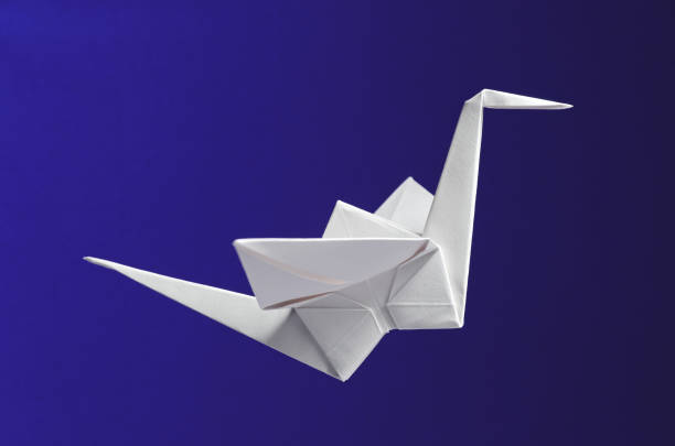 istock White Origami On Blue Background 1318633267