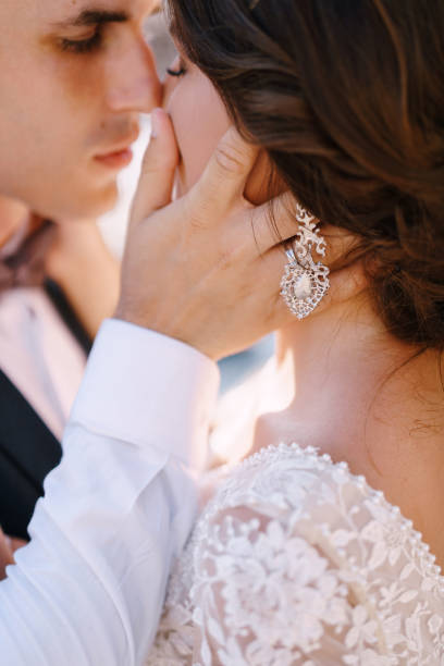 istock Bride And Groom Embracing Outdoors 1318636840