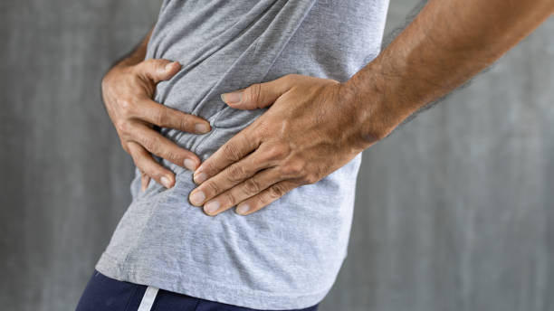 istock man suffering from hip joint pain, pelvic hip joint dislocation, arthritis 1318637531