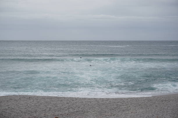 istock Surfers on the Orzan beach. 1318638513