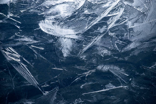 istock Transparent ice crystals texture cracked background 1318639873