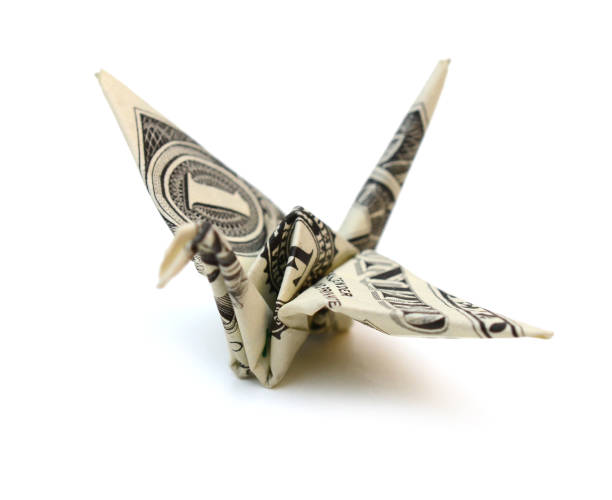 istock A dollar origami crane on white 1318643124