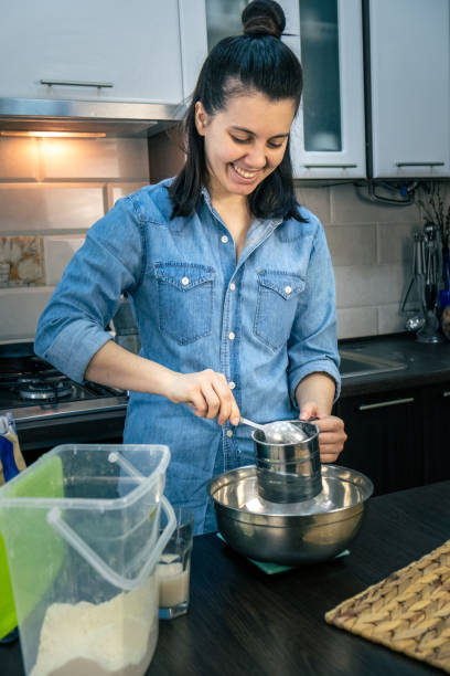 istock woman cooking with flour 1318649321