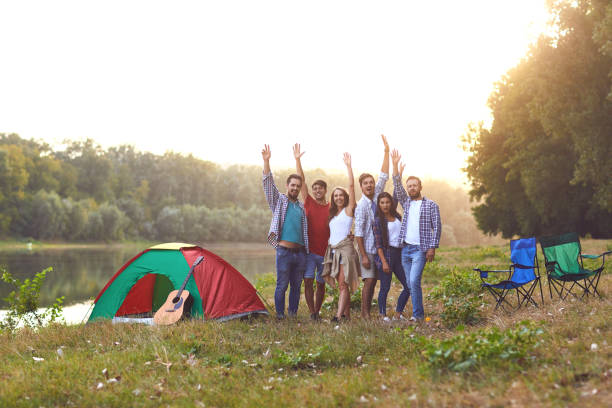 istock Group of people smiling standing on a picnic 1318651210