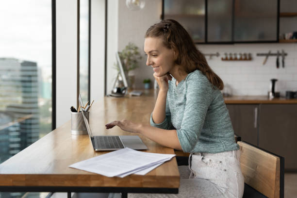 istock Smiling female employee work on laptop in office 1318654241