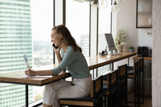 istock Smiling woman consult client working on laptop 1318654318