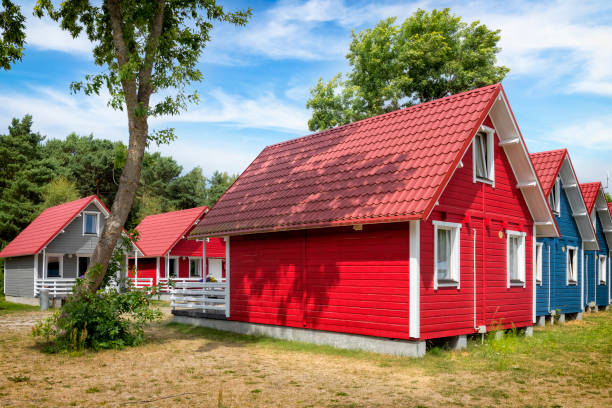 istock Colorful, swedish style camping cabins in a summer day 1318654362