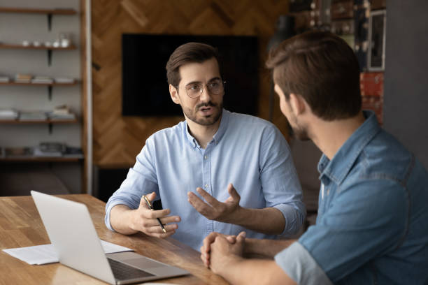 istock Caucasian businessmen brainstorm discussing ideas in office 1318654407