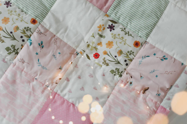 istock Pink patchwork blanket. Baby bedding. Bedding and textile for nursery. Nap and sleep time 1318655480