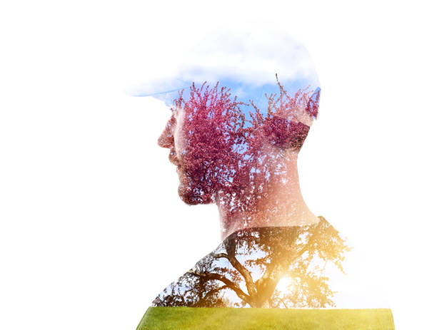 istock Multiple Exposure of young man and apple blossoms 1318655495