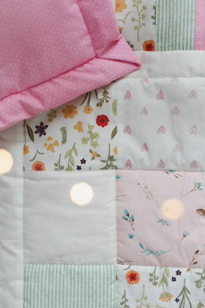 istock Patchwork blanket. Baby bedding. Bedding and textile for nursery. Nap and sleep time 1318655553