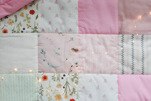 istock Pink patchwork blanket. Baby bedding. Bedding and textile for nursery. Nap and sleep time 1318655622