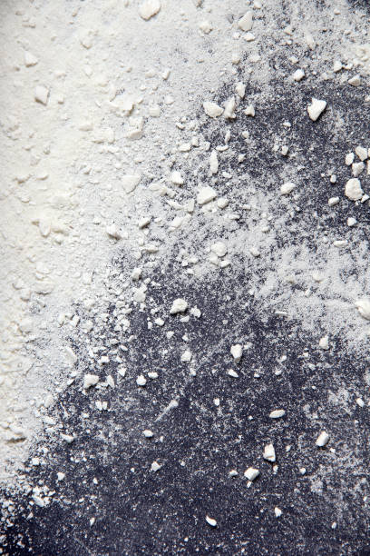 istock White dust. White powder. Scattering white particles. Abstract background 1318657671
