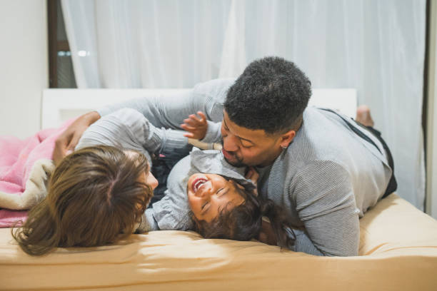 istock Family of 3 sharing a good time 1318659590