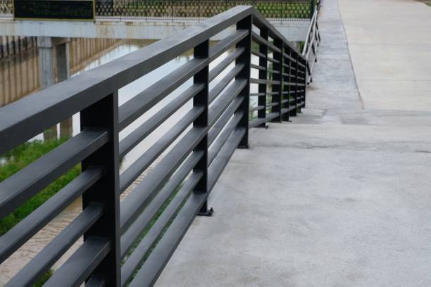 istock black iron railing separates walkway for safety 1318661103