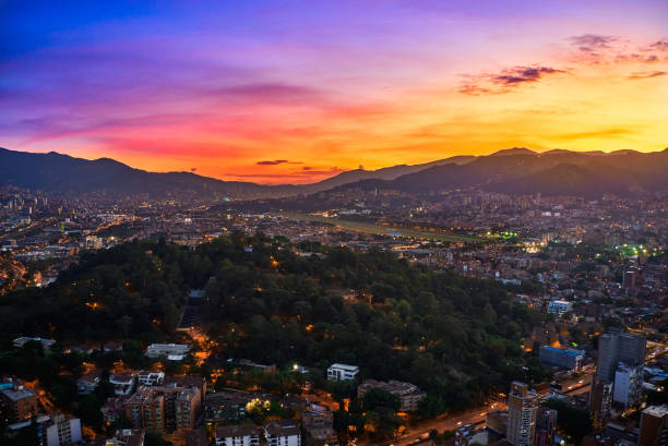 sunset view in medellin with orange tones in its sky
