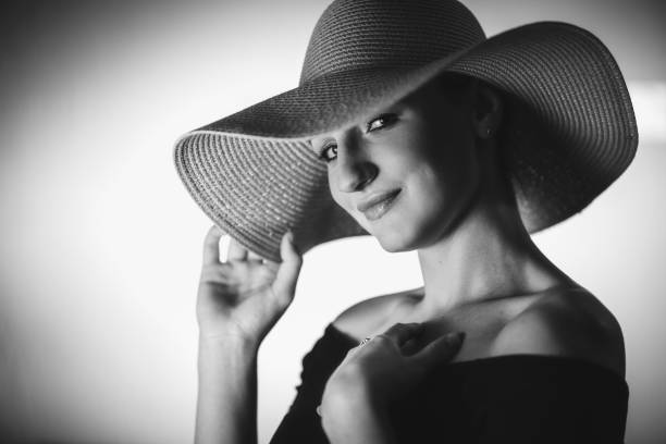 istock Beautiful elegant woman with oversized hat 1318666503