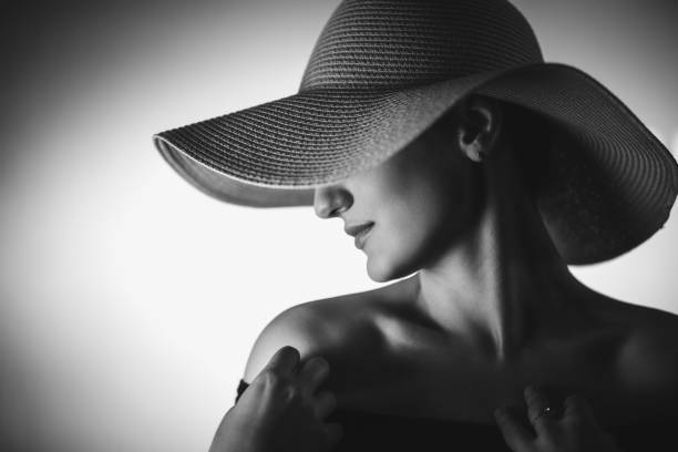 istock Beautiful elegant woman with oversized hat 1318666547