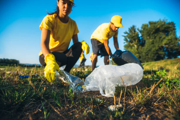 istock People cleaning up garbage in nature 1318669351