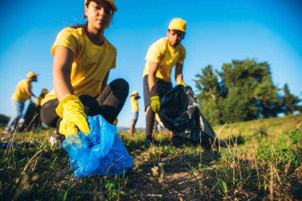 istock People cleaning up garbage in nature 1318669541