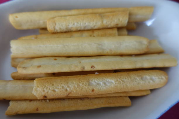 istock Breadsticks with seeds and olive oil for aperitif 1318670630