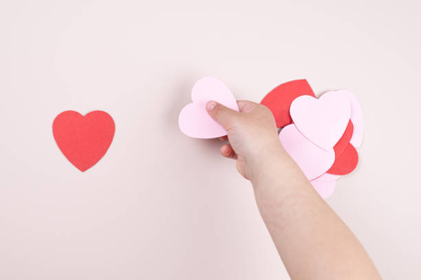 istock A child holding a heart in his hand 1318670974