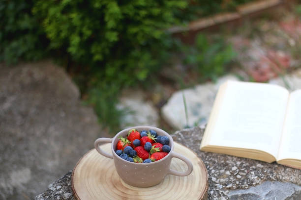 istock Bowl of Fruit and Book 1318672592