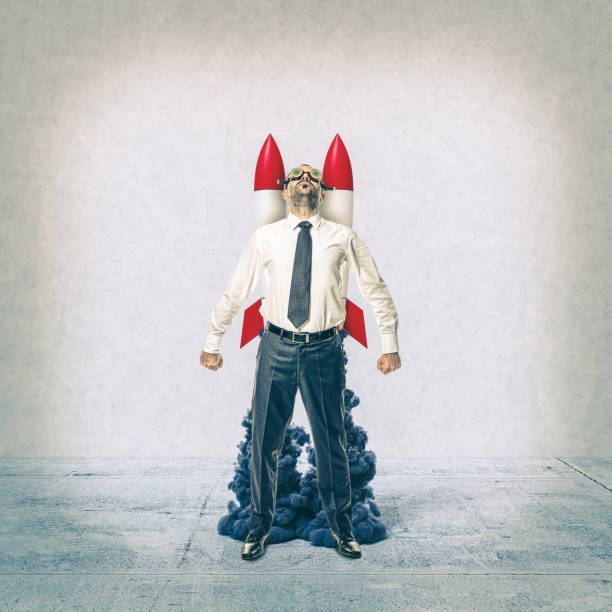 istock businessman with rockets on his back. 1318673158