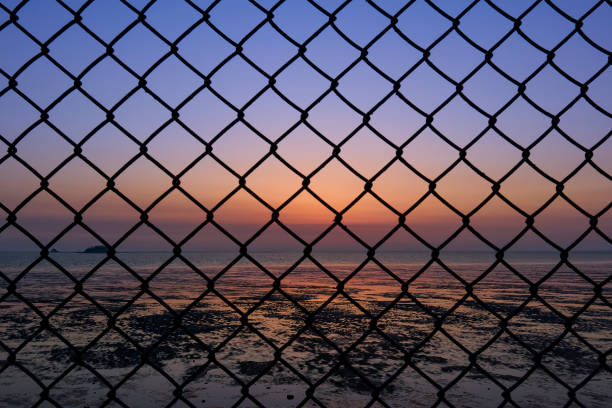 istock The sun sets over the sea 1318673189