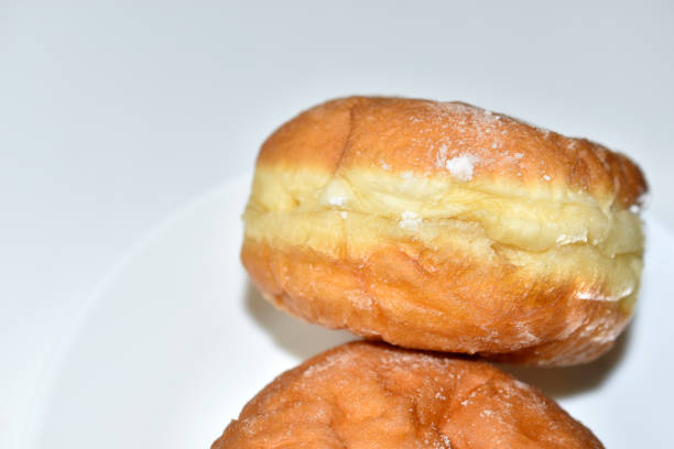 istock Two delicious doughnuts on a saucer with filling 1318678153