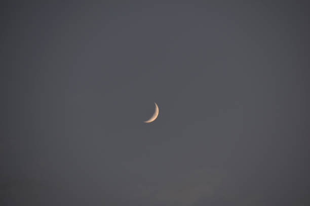 istock The distant moon in the sky against the blue sky 1318678190