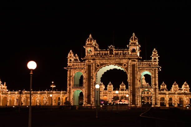 Mysore palace during Dasara festival celebration Mysore palace lights, dasara festival celebration mysore stock pictures, royalty-free photos & images