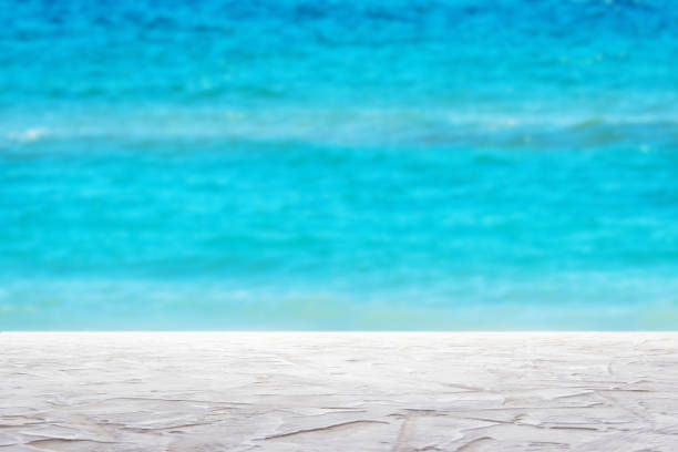 istock textured white surfaceon blur sea background - can be used for display or montage your products 1318679594