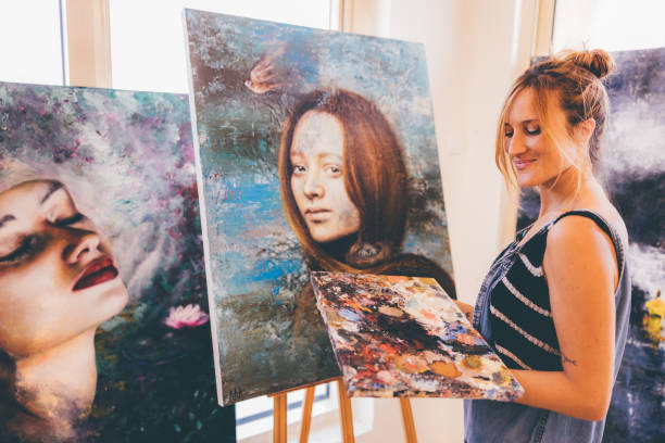 istock Portrait of a Professional Female Painter Working at her Studio 1318680487