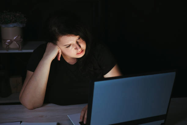 istock Tired exhausted business woman working at night 1318680949