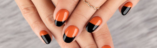 istock Manicured womans hand over gray furry background 1318681066