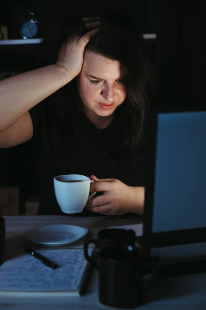 istock Woman drinking too much coffee at night work 1318681142