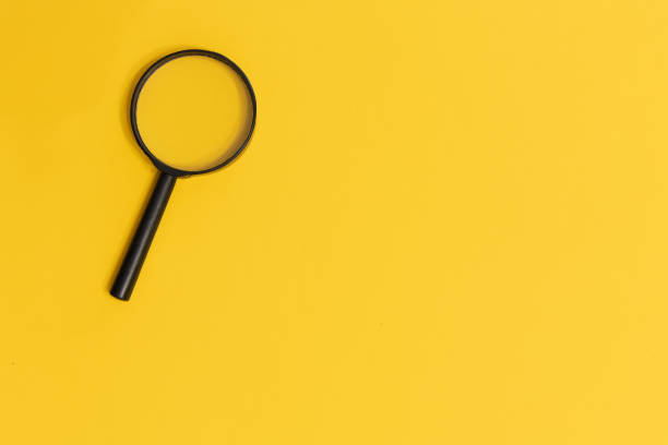 istock Magnifying glass on yellow colour background with copy space for text. Searching information data concept creative idea and innovation 1318683677
