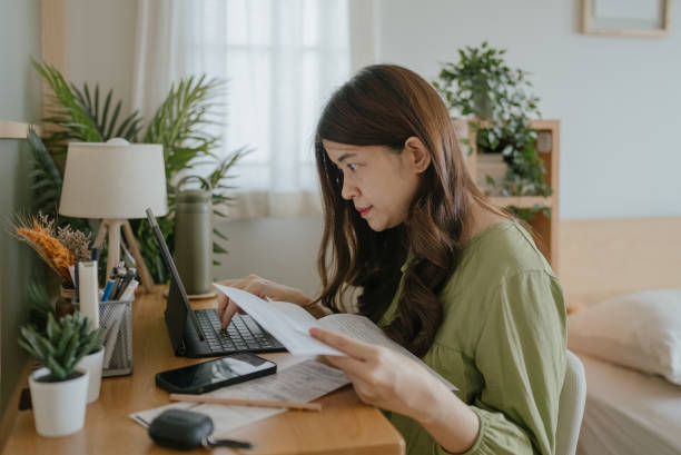 istock Women managing home finance. 1318684727