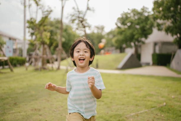 istock Happy littler boy in garden. 1318684806