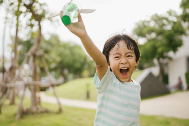 istock Happy littler boy in garden. 1318684807