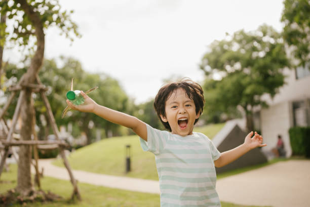 istock Happy littler boy in garden. 1318684808